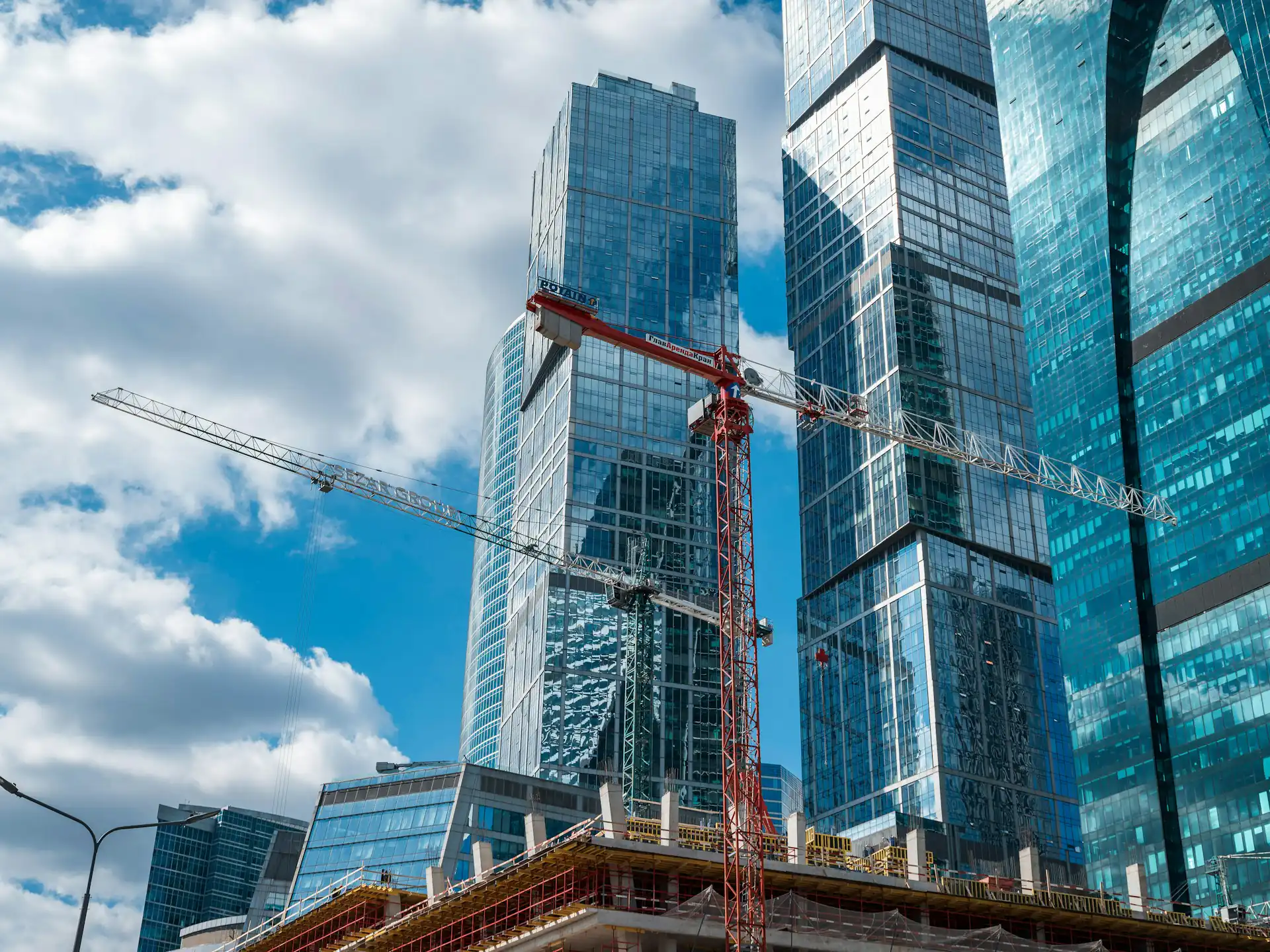 High-rise towers under construction with tower cranes